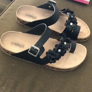 Black leather sandal with floral embellishment, size 9, never worn brand new!